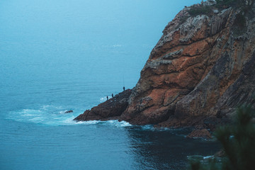 People fishing on the rocks in the Antlantic Ocean
