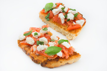 Italian bruschetta with tomatoes, mozzarella cheese and basil