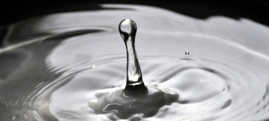 Photo of water droplet splash close up. 