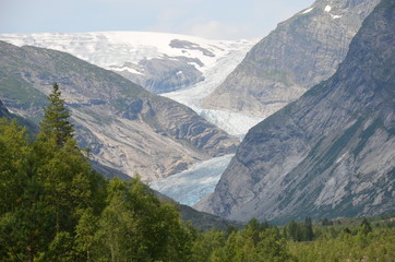Fototapeta premium Nigardsbreen is another famous language of Jostedalsbreen. Like other glaciers, it melts, forming a powerful river - an impressive sight!
