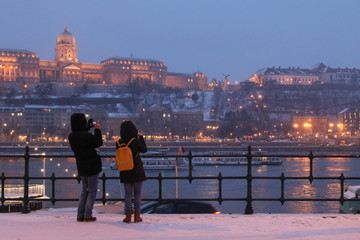 couple taking photograph of budapest panorama
