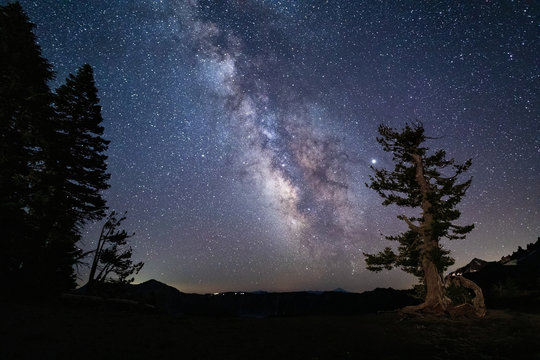 Milky Way galaxy and starry night sky over Crater Lake National Park, Oregon