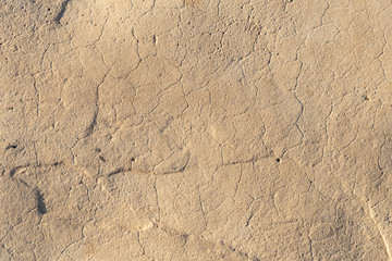 Concrete coating. Cracked stone background. Cement slab. Wall of the house.