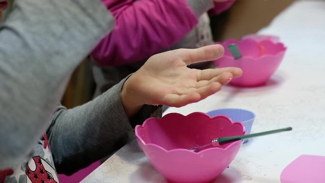 Children make a slime in a creativity lesson.
