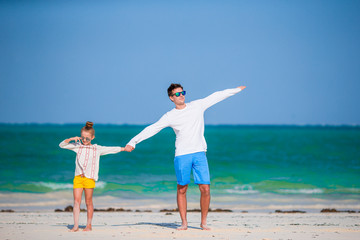 Father and kids enjoying beach summer vacation