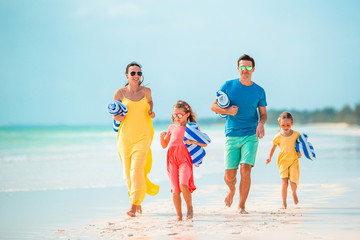 Young family on vacation on the beach