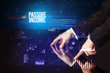 Businessman touching huge screen with PASSIVE INCOME inscription, cyber business concept