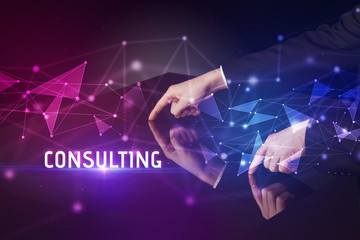 Businessman touching huge screen with CONSULTING inscription, modern technology business concept