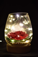 glass of cognac on black background
