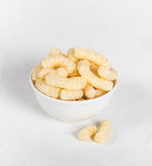 Dry quick healthy Breakfast, sweet corn sticks on a light background