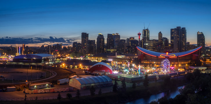 CALGARY, CANADA - JULY 8: Panoramic view of the the Calgary Stampede at sunset on July 8, 2016 in Calgary, Alberta. The Calgary Stampede is often called the greatest outdoor show on Earth.