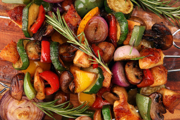 Grilled pork shish or kebab on skewers with vegetables . Food background shashlik