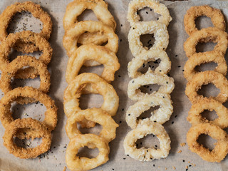 food, squid rings breaded with sauces on a black background, serving example