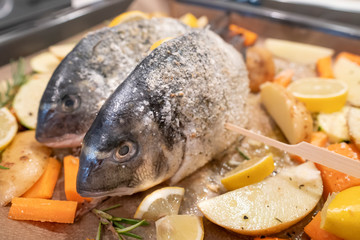 Filled sea bream on oven-cooked vegetables