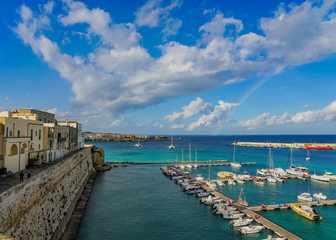 Fototapeta na wymiar view of port of Puglia Italy and rainbow