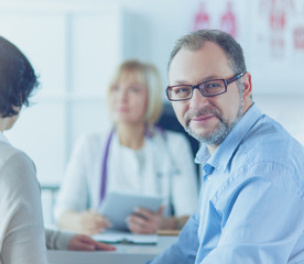 Fototapeta premium Smiling medical doctor and patient. Health care