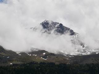 mountain / rock in Italy with clouds hanging deep in the Alps of Italy