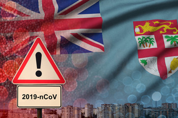 Fiji flag and Coronavirus 2019-nCoV alert sign. Concept of high probability of novel coronavirus...