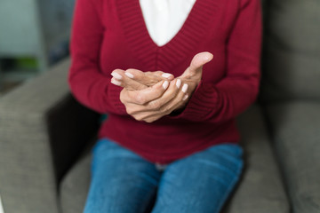 Fototapeta premium Closeup Of Woman Suffering From Pain In Hand