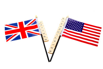 The flags of the United Kingdom and the United States isolated on a white background with a sign reading Special Relationship