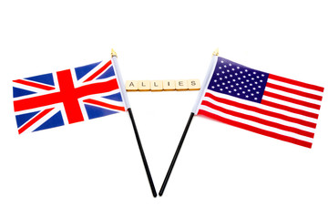 The flags of the United Kingdom and the United States isolated on a white background with a sign reading Allies