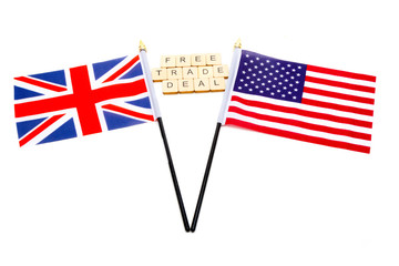 The flags of the United Kingdom and the United States isolated on a white background with a sign reading Free Trade Deal