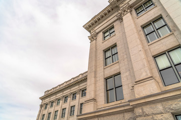 Utah State Capitol Building with decorative mouldings viewed against cloudy sky