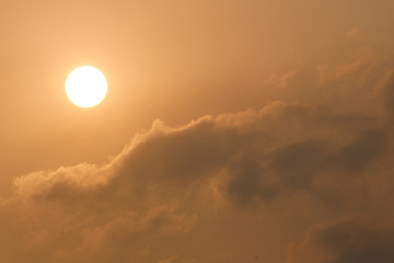 The yellow light of the sunset Hit the surface of the cloud