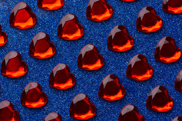 Blue background with many little crystal red hearts