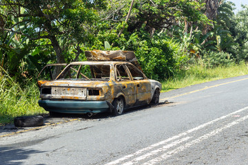 burnt out car next to the road