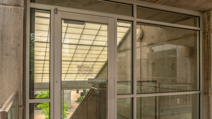 Panorama frame Glass door and wall at the balcony of building with stairs on the other side