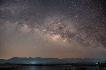 At night have stars, milky way and galaxies filled the dark sky.