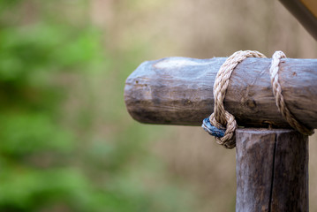 closeup of rope tied around post