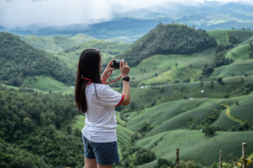 Fototapeta na wymiar Travel and take pictures at the top of the mountains in northern Thailand