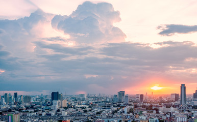 Naklejka na ściany i meble Bangkok cityscape at sunset under dramatic sky before haevy rain