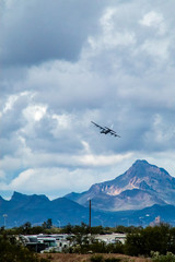 Fototapeta na wymiar C-130 flying over mountains