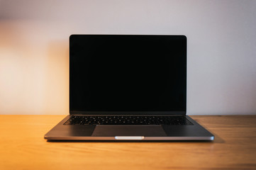 Fototapeta premium Laptop on modern wooden desk