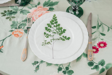  table setting on a vintage tablecloth with embroidery