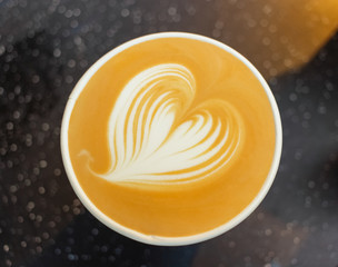 Latte art of latte coffee.  Heart-shaped pull flower art