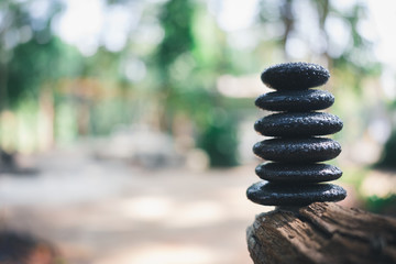 Balance stone with spa on nature bokeh background