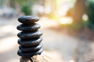 Balance stone with spa on nature bokeh background