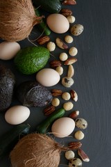 Ketogenic Diet.Lchf. Avocado,coconut,  eggs and nuts on a black slate background. Keto food. Vegetables and nuts for low carb diet.