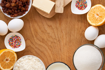 Ingredients for making easter cake on a wooden table
