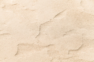 Sand ripples on the beach, close-up photo. Abstract natural background texture