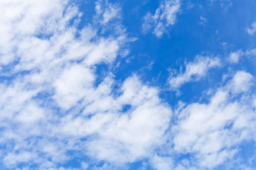 Obraz premium White altocumulus clouds layer in blue sky at daytime, natural background