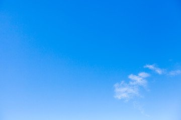 Group of small white clouds in blue sky, natural background photo
