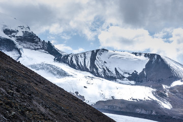 Fototapeta na wymiar beautiful landscape on snowy cliffs with clouds