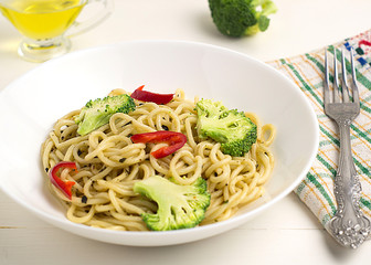 Traditional spaghetti with broccoli close-up. Italian cuisine.