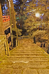 old path to the temple in autumn night