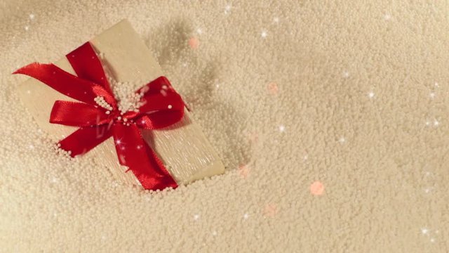 beautiful gift on a white background lies in styrofoam balls with blasts